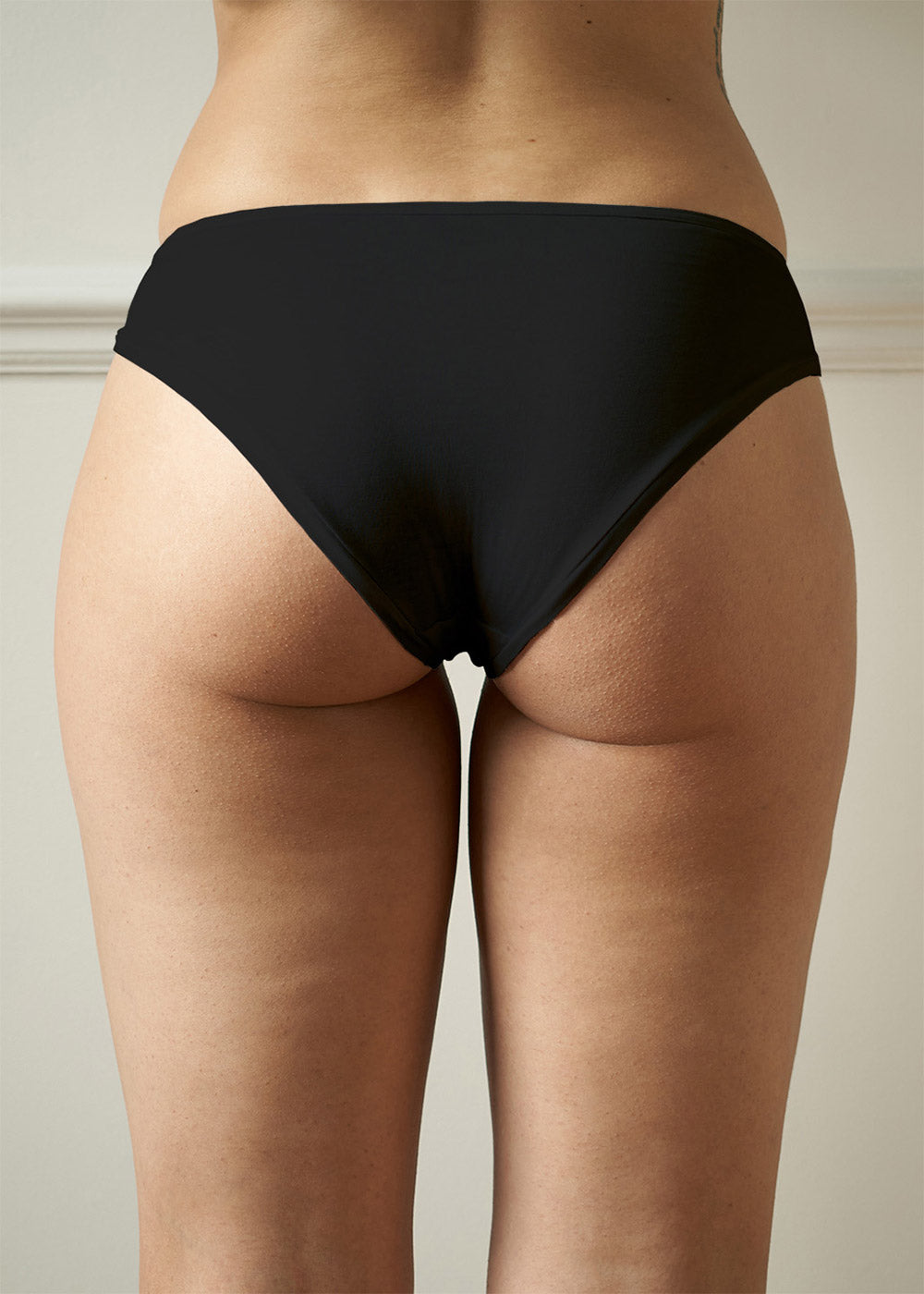 Ladies Mid rise briefs in black, on a UK size 10 female - Back image